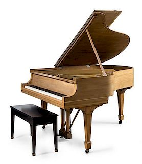 A Steinway & Sons Mahogany Baby Grand Piano Width 66 inches.