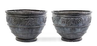 * A Pair of Cast Lead Urns Height 23 5/8 inches.