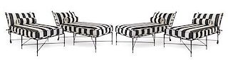 * A Set of Four Painted Metal Chaise Longues Height of chaise longue 33 x width 31 x depth 64 inches.