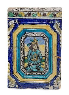 * A Qajar Molded Pottery Tile Length 18 3/4 inches.