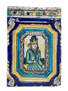 * A Qajar Molded Pottery Tile 17 5/8 x 12 inches.