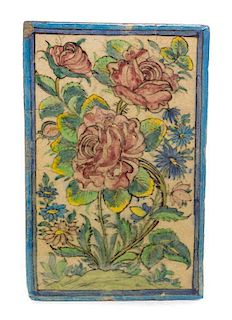 * A Qajar Pottery Tile 15 x 9 3/4 inches.
