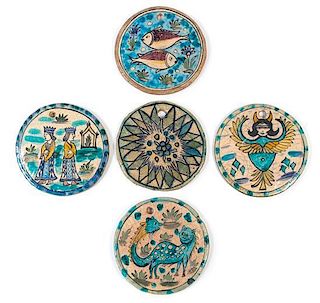 * A Group of Five Qajar Pottery Beehive Covers Diameter of largest 8 1/4 inches.