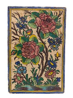 * A Qajar Pottery Tile 15 x 9 7/8 inches.
