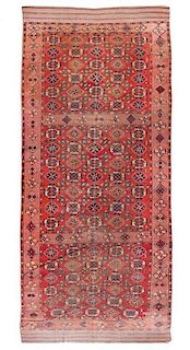 * A Turkoman Wool Rug 6 feet 8 inches x 15 feet 9 inches.