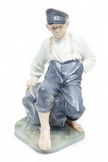 Royal Copenhagen (Danish) Porcelain Figural Grouping, Boy Seated on Rock, H 12.5" W 7" L 10"