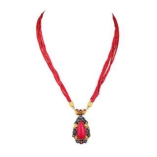 A Gold and Coral Pendant Necklace