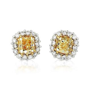 A Pair of White and Yellow Diamond Stud Earrings