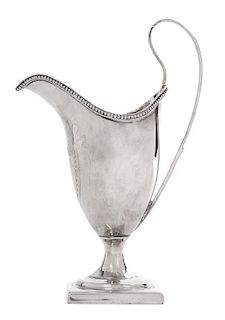 * An English Silver Footed Creamer, George III, Late 18th/Early 19th Century, with beaded decoration along edge.