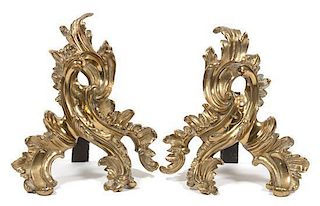 A Pair of Louis XV Style Brass Chenets Height 12 inches.