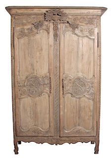 A Louis XV Provincial Pine Armoire Height 88 3/4 x width 55 x depth 24 inches.