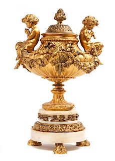 * A French Gilt Bronze Diminutive Lidded Urn Height 12 inches.