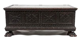 * A Continental Carved Wooden Chest Height 20 1/2 x width 48 x depth 24 inches.