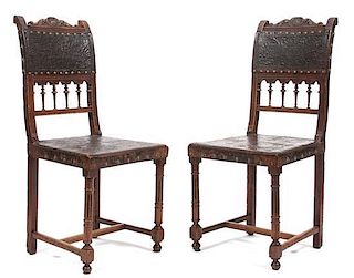 A Pair of Renaissance Revival Hall Chairs Height 37 1/2 inches.
