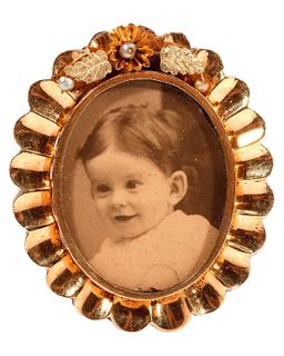 A 14k gold locket brooch