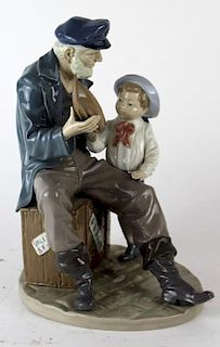 Lladro seated man with young boy