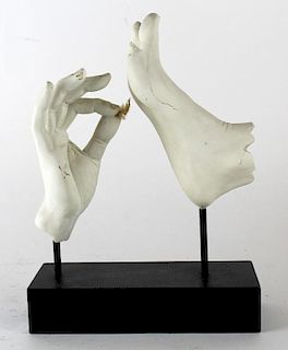 Sculpture of hand tickling foot