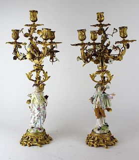 Pair of figural porcelain bronze candleabra