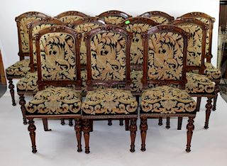 Set of 12 French carved chairs with needlepoint