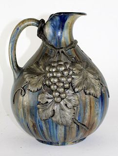 French glazed ceramic pitcher with raised pewter