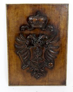 Relief carved walnut coat of arms