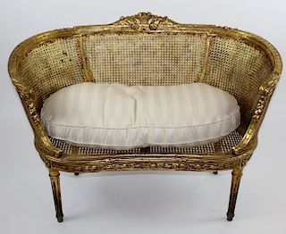 Louis XVI style caned settee