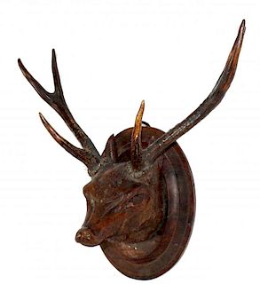 Carved Black Forest deer head with antlers.