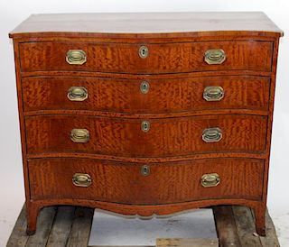 English serpentine front chest of drawers