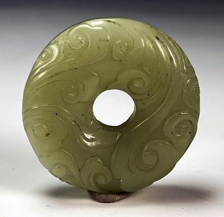 ANCIENT STYLE JADE BI DISC WITH CARVED PATTERNS