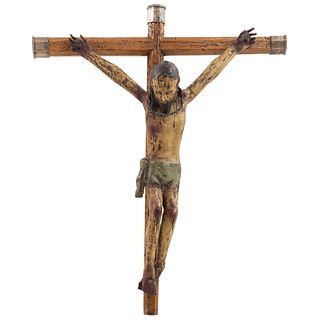 CRISTO CRUCIFICADO. FINALES DEL SIGLO XIX. Talla en madera policromada, cruz en madera con remates en metal.
