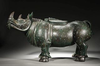 A Gold and Silver-Inlaid Bronze Rhinoceros Zun