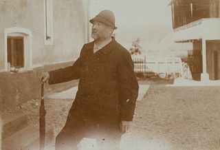 Unknown (19th), Man with umbrella and hat in the courtyard, around 1900, Sepia-Photography