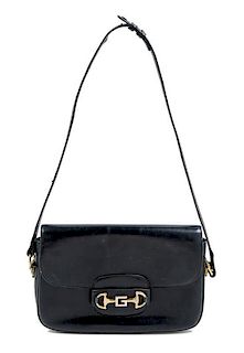 A Gucci Black Leather Handbag 10.5" x 7" x 2.5".