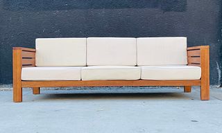 Teak Wood 3 Seater Sofa With Cream Colored Cushions.