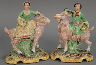 Pair of Staffordshire figures of boy and girl on goats. 
height 6 3/4 inches