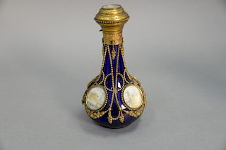 Gilt metal mounted scent bottle having five miniature paintings over cobalt blue glass. ht. 6 1/2in.