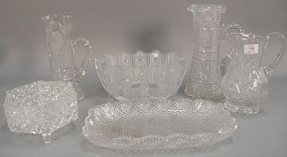 Six cut glass pieces to include three pitchers, diamond cut tray lg. 14 1/2in., footed bowl, and large oval bowl.