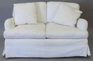 Custom white upholstered love seat.