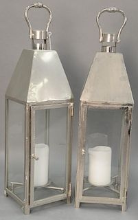 Pair of metal and glass candle holders. ht. 27in.