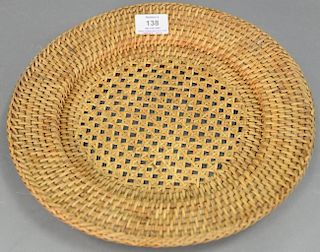 Set of thirteen Artesian rattan wicker woven charger plates (dia. 13in.), small square coaster, and wine bottle holder.