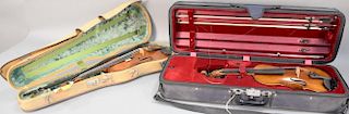 Two violins in fitted case with two bows, one is marked Francesco Ruggeri Dett Il and the other with old paper label.