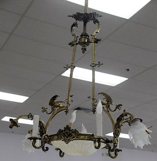 Victorian gothic style brass ten light chandelier with winged griffins over center glass dome surrounded by four arms with ca