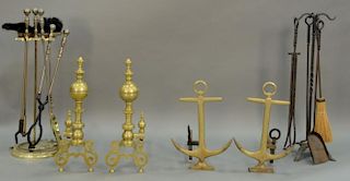 Four piece lot to include two pairs of brass andirons (one is anchor style) and two sets of fire tools. andirons ht. 22in. & 