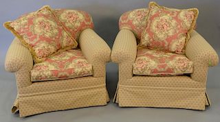 Pair of custom upholstered red and tan club chairs with down filled cushions.