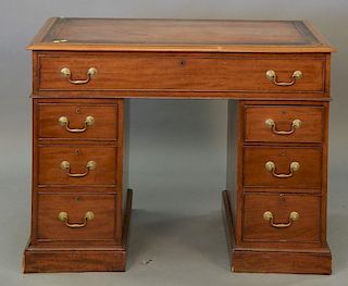 George IV mahogany leather top desk in three parts having adjustable height top with several angles on double bank of drawers