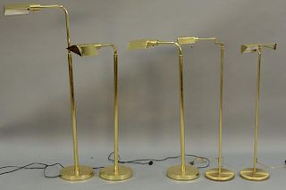 Group of five brass floor lamps.