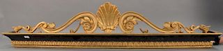 Set of four gilt and black painted valances having center carved shell flanked by scroll and leaf design.
