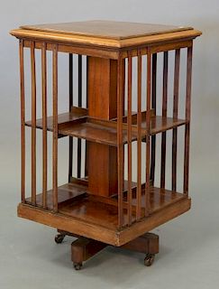 Inlaid mahogany revolving bookcase. ht. 35in., top: 20" x 20"