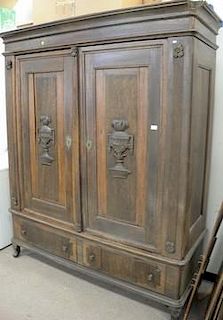 Large oak armoire with shelved interior on left, 19th century. ht. 88in., wd. 69in., dp. 25in.