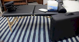 Two portable massage tables with two new sets of sheets.